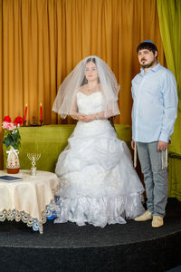 Man and woman standing on stage