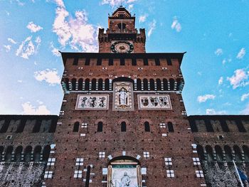 Low angle view of clock tower against sky