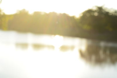 Defocused image of lake against sky