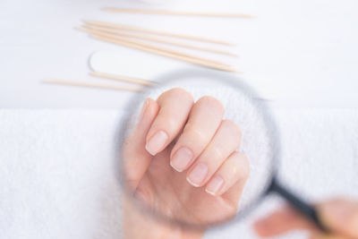 Cropped image of woman holding tape measure