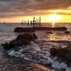 Scenic view of sea against sky during sunset