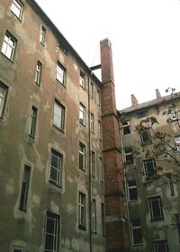 Low angle view of old building against sky