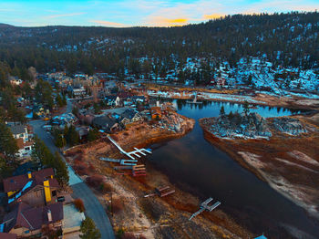 High angle view of river by city against sky