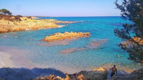 Scenic view of sea against clear blue sky