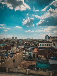 High angle view of buildings in city against sky