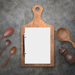 High angle view of hands on cutting board