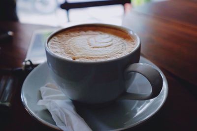 Close-up of cappuccino on table