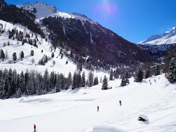 Ski lift on snow covered landscape