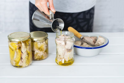 Midsection of person preparing food on table