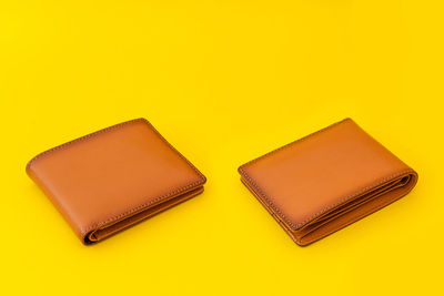 High angle view of piano on table against yellow background