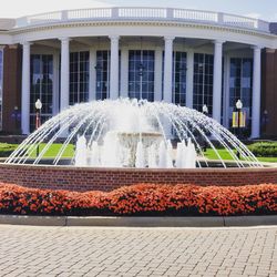 Fountain with building in city