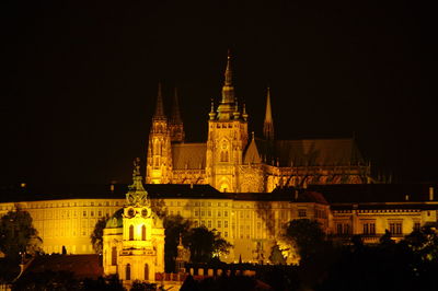 Illuminated cathedral against clear sky at night
