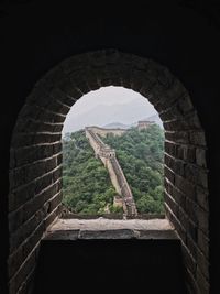 View of historical building through arch window