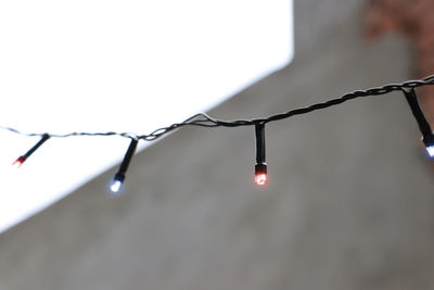 Close-up of wet illuminated lights in rainy season