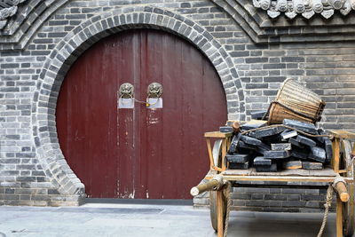 1588 maroon painted round wooden door-city wall's yongning south gate.  xi'an-shaanxi-china.