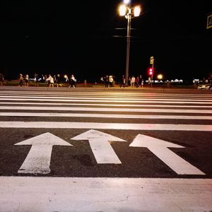 People on city street at night