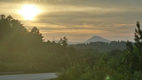 Scenic view of landscape against sky during sunset