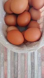 High angle view of eggs in crate on table