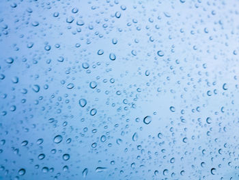 Full frame shot of wet window in rainy season