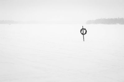 Scenic view of sea against sky during winter