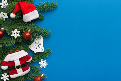 Directly above shot of christmas decorations on blue background