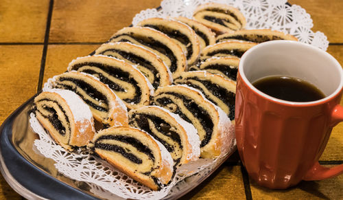 High angle view of dessert by coffee on table