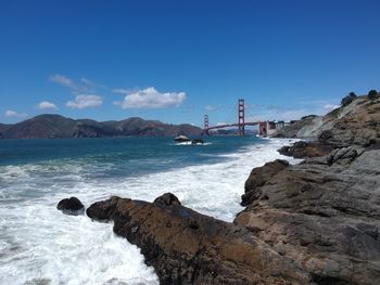 Scenic view of bay against sky