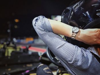 Rear view of woman wearing helmet during go-carting