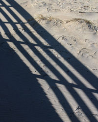 High angle view of shadow on sand at beach