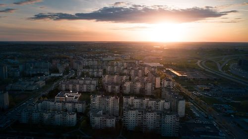 High angle view of buildings against sky during sunset