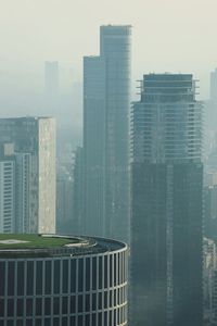 Modern buildings in city against sky