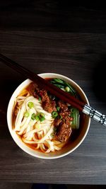 High angle view of taiwanese beef noodle soup with chopsticks 