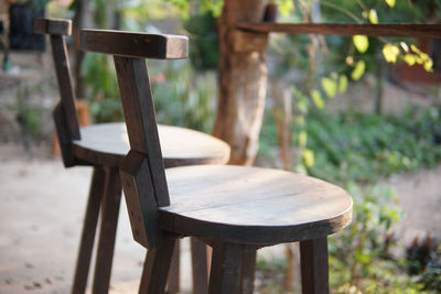 Close-up of empty bench on table