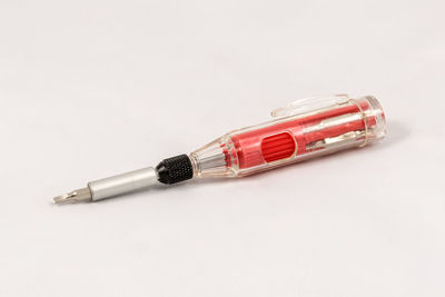 High angle view of pen on table against white background