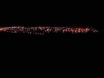 Illuminated cityscape at night