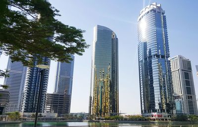 Low angle view of modern buildings against sky