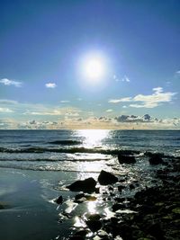 Scenic view of sea against sky at sunset