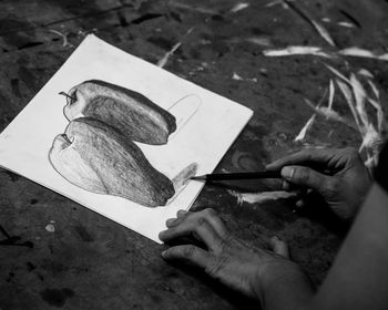 Close-up of man working on paper