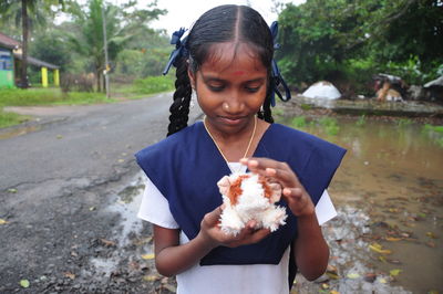 Close-up of girl holding stuffed toy