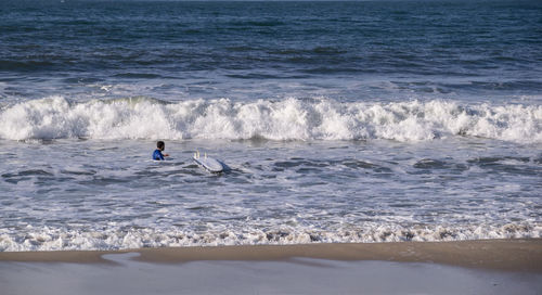 Man surfing in sea