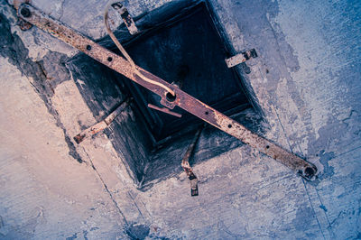 High angle view of rusty metal on floor