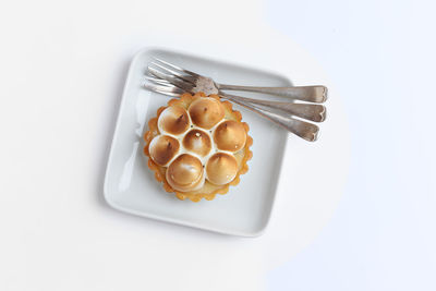 Close-up of pastry on white background