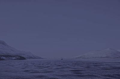 Scenic view of snowcapped mountains against clear sky