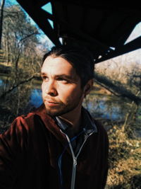 Portrait of young man looking away