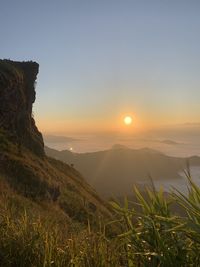 Scenic view of mountains against sky during sunset