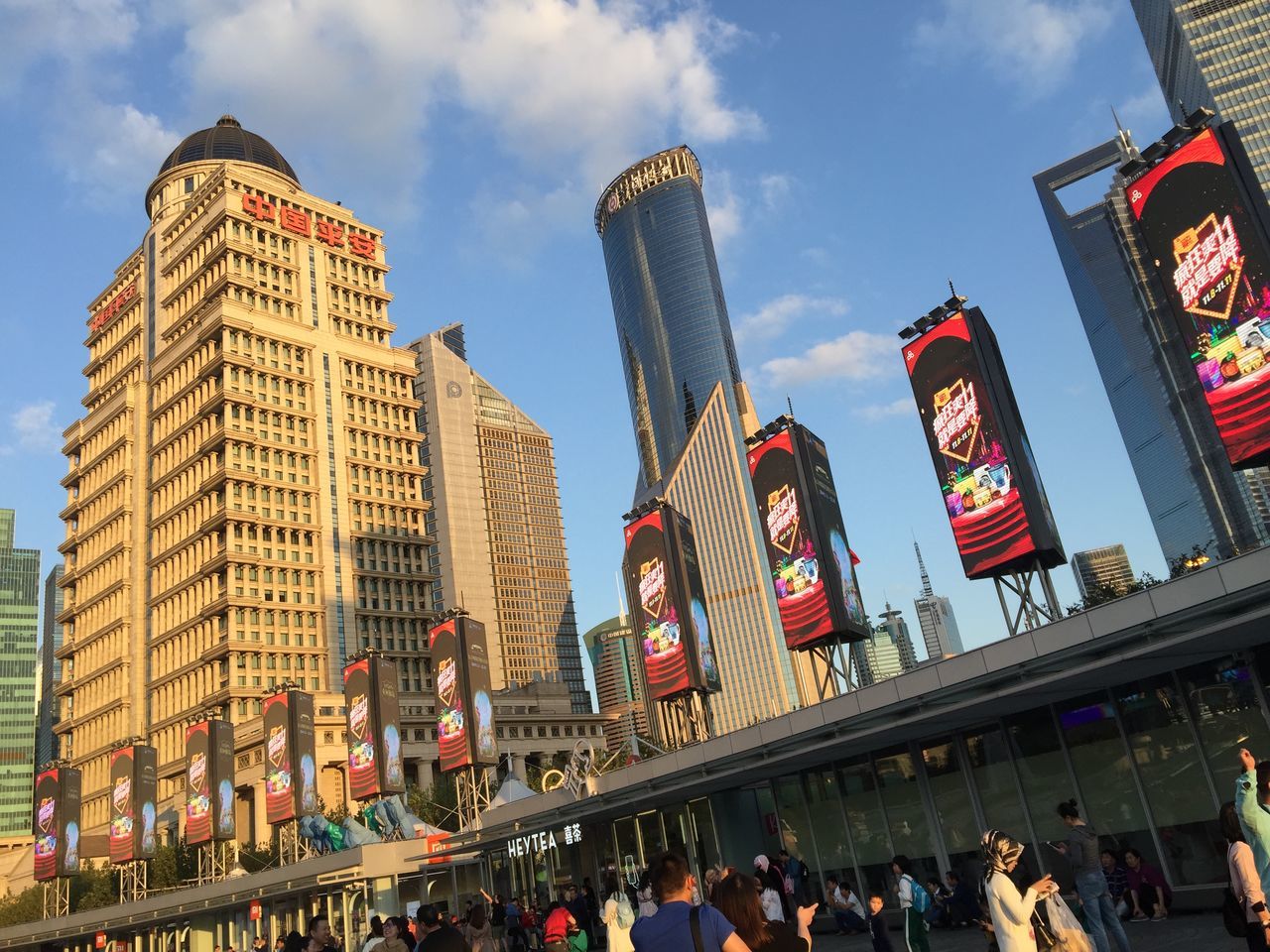 LOW ANGLE VIEW OF PEOPLE IN CITY BUILDINGS