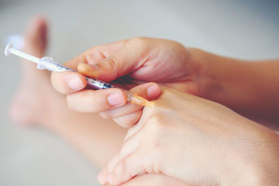 Close-up of man holding hands