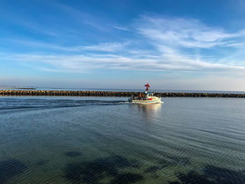 Scenic view of sea against blue sky