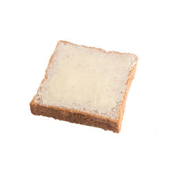 Close-up of cake on plate against white background