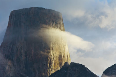 Low angle view of rock formation against sky